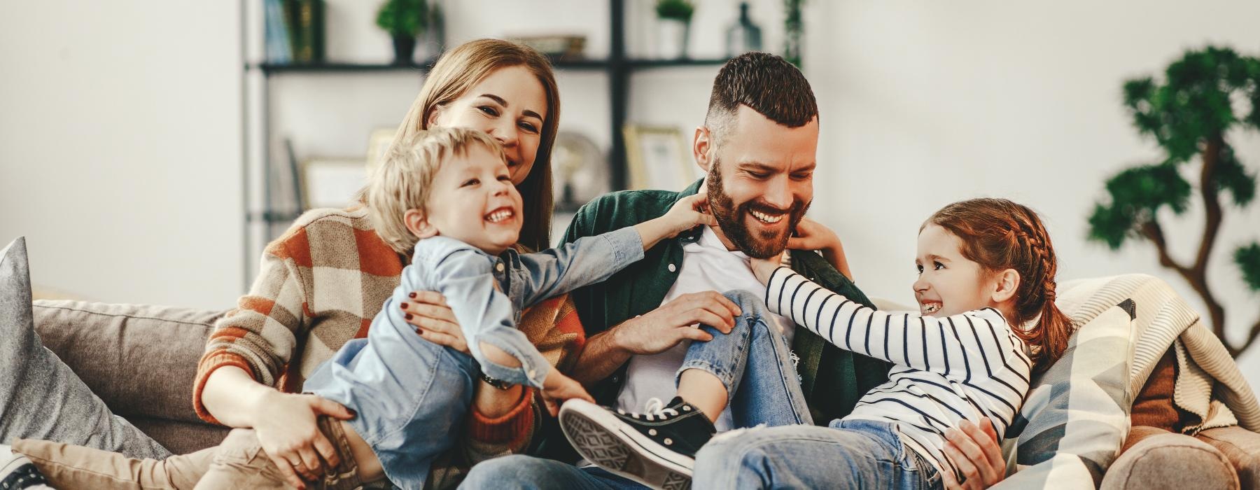 a family sitting on a couch