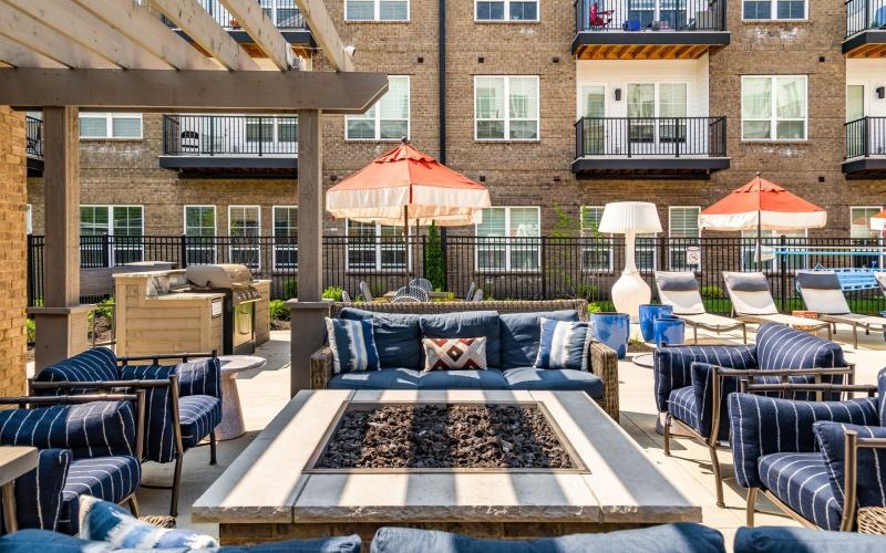a patio with chairs and tables