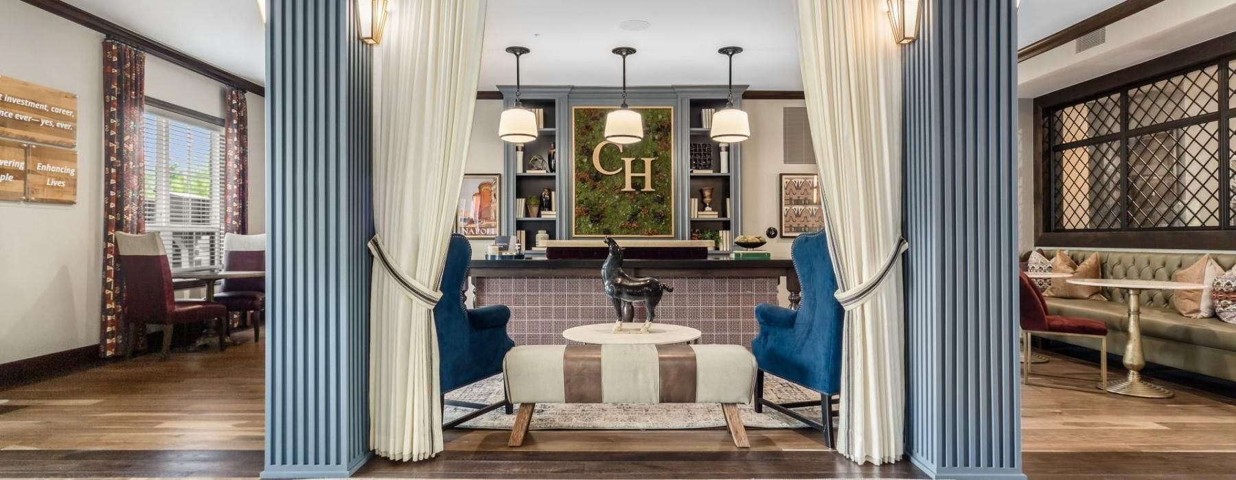 a room with a large mirror and a large tub