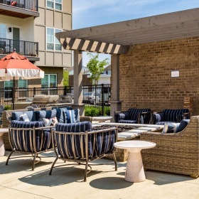 a patio with chairs and tables