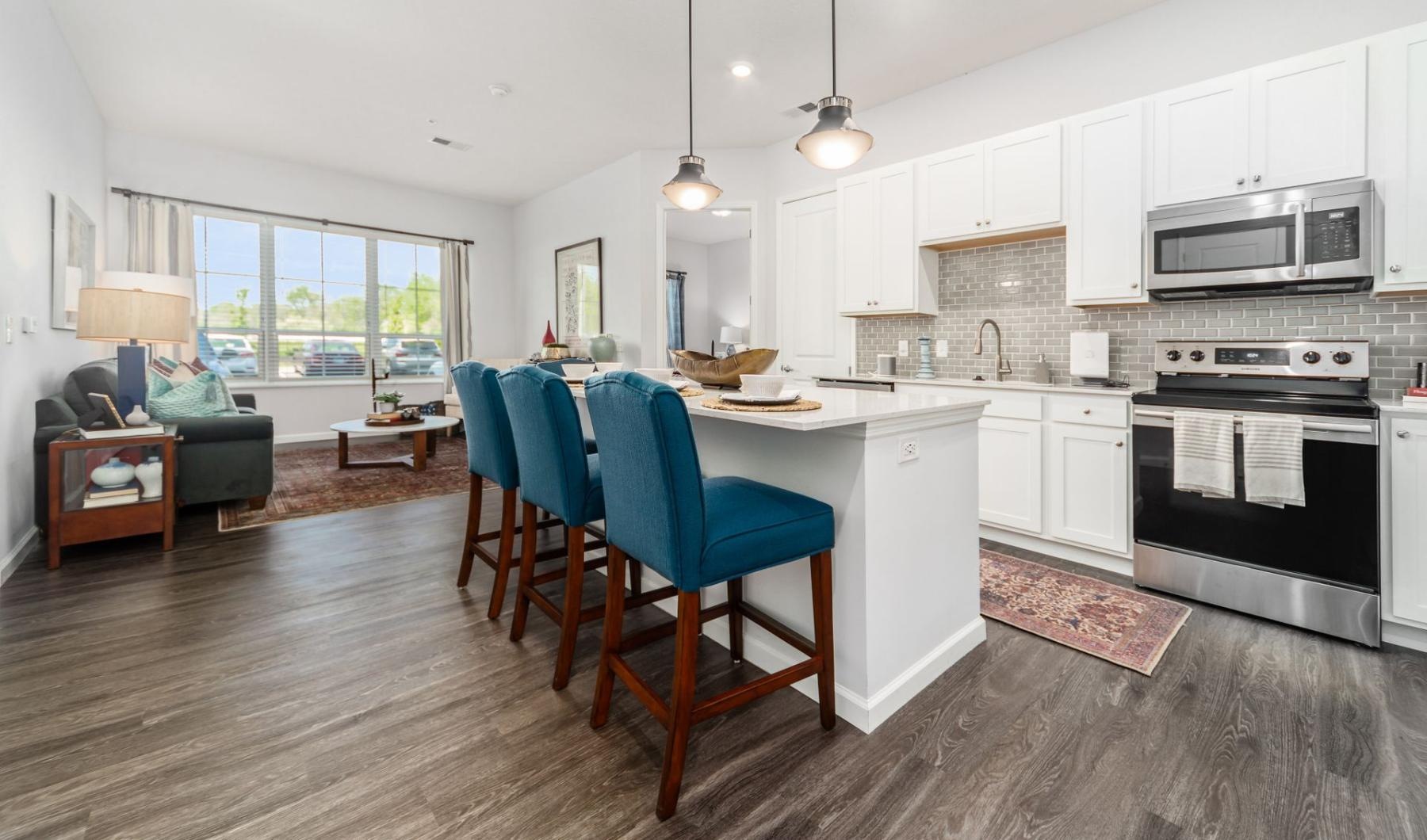 a kitchen with a table and chairs
